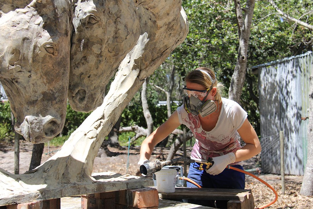 Lynne applying the patina